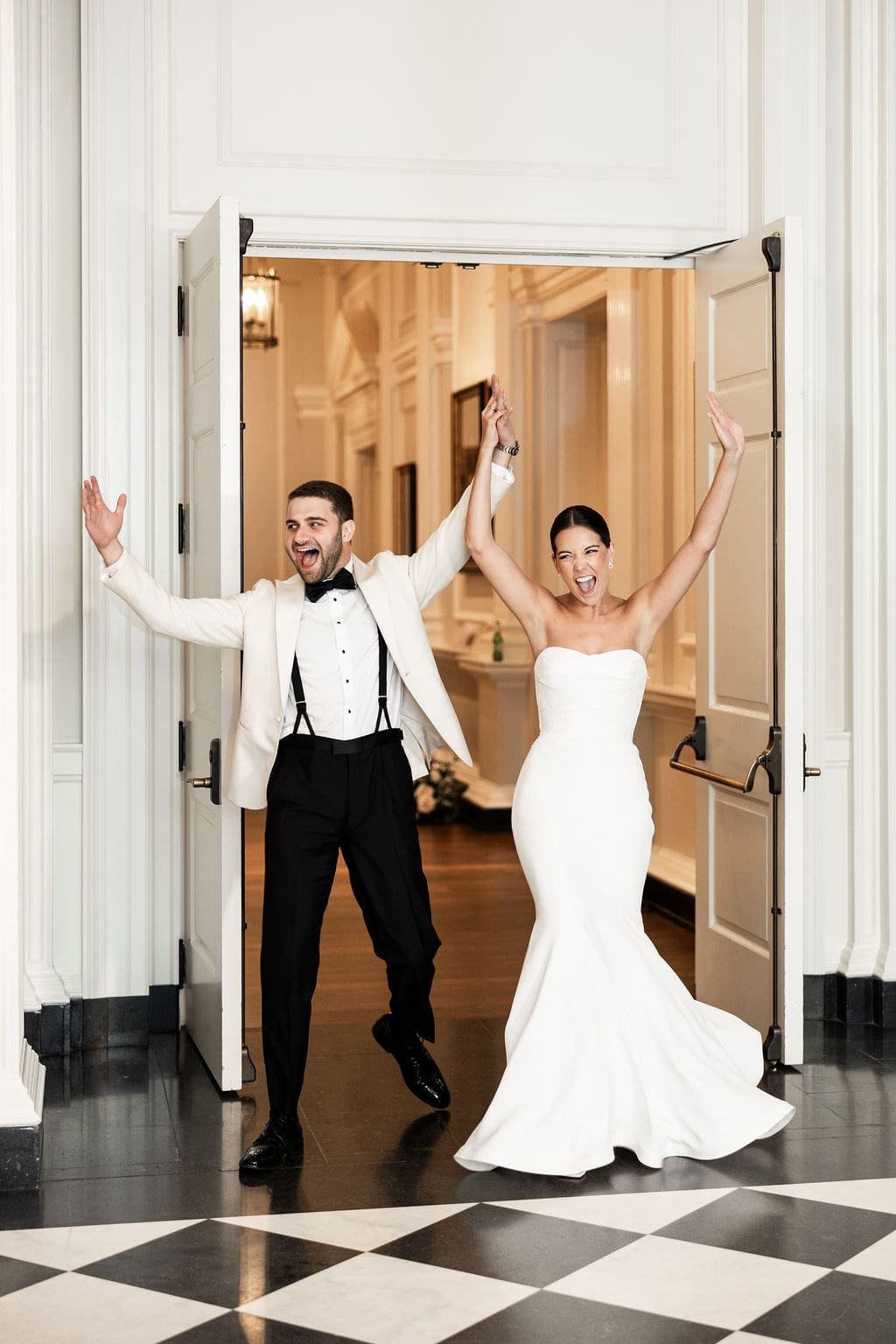 Bride and groom enter the Chicago History Museum wedding reception