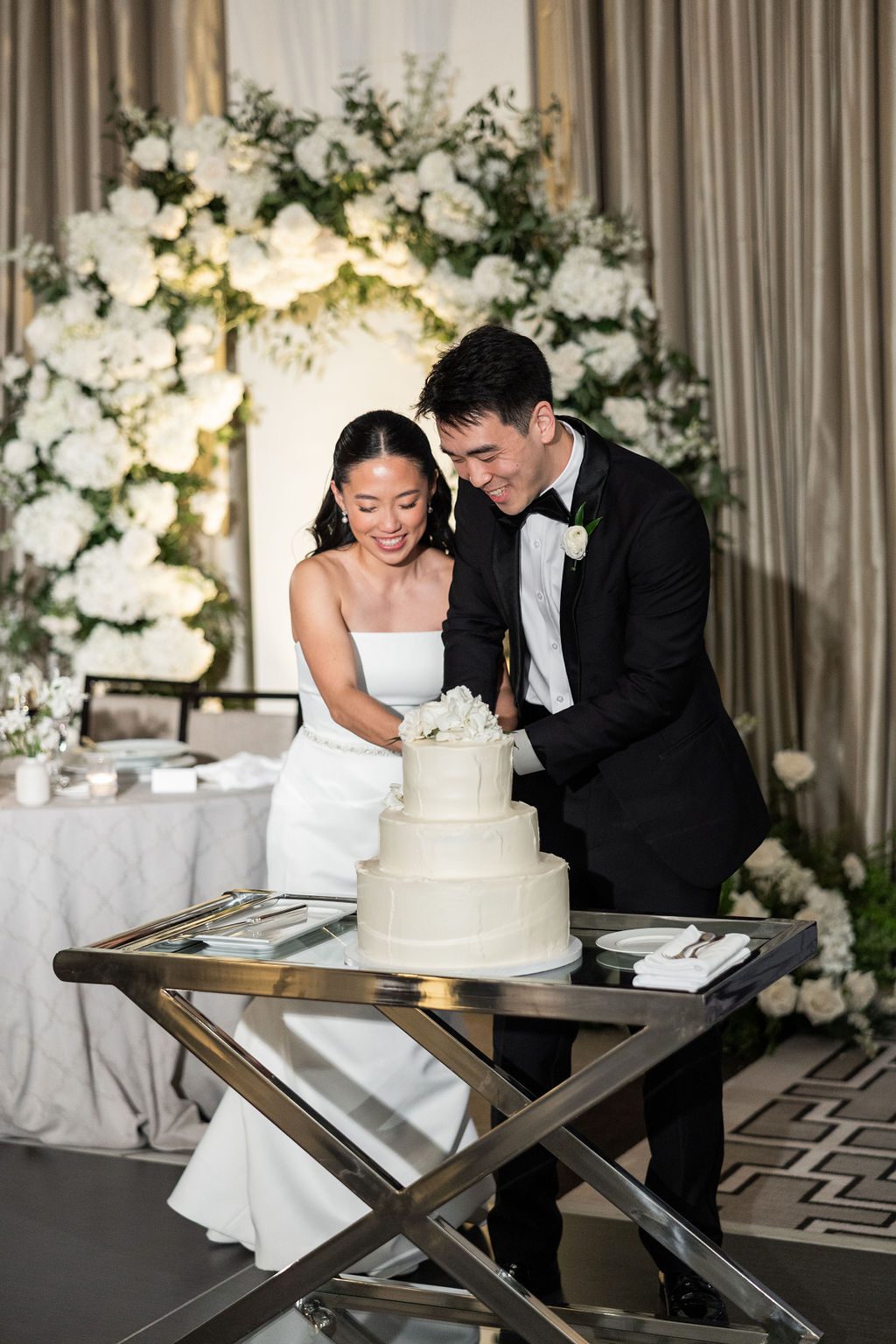 Bride and groom cut their cake at The Langham Chicago