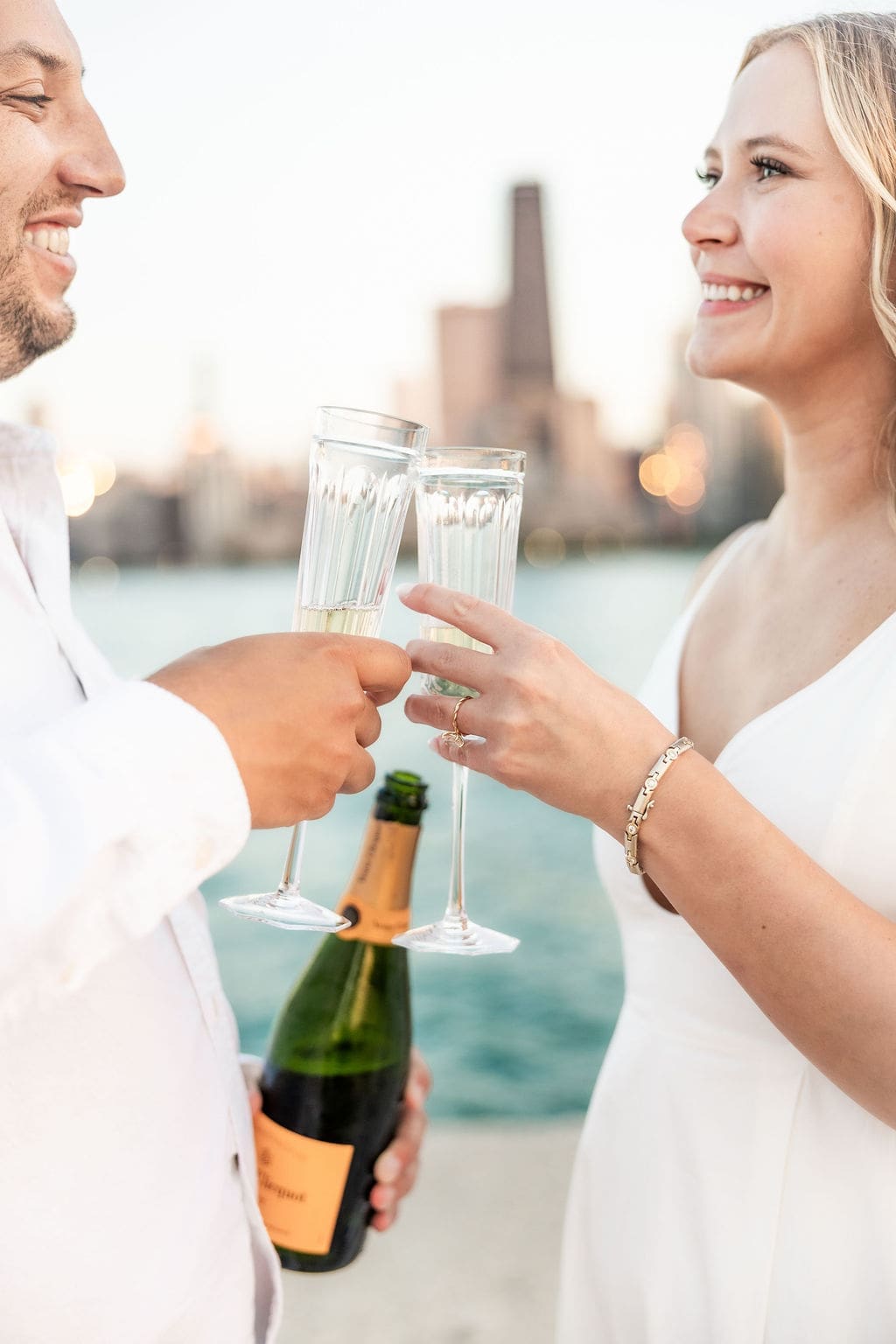 Couple toasts during North Avenue Beach engagement session