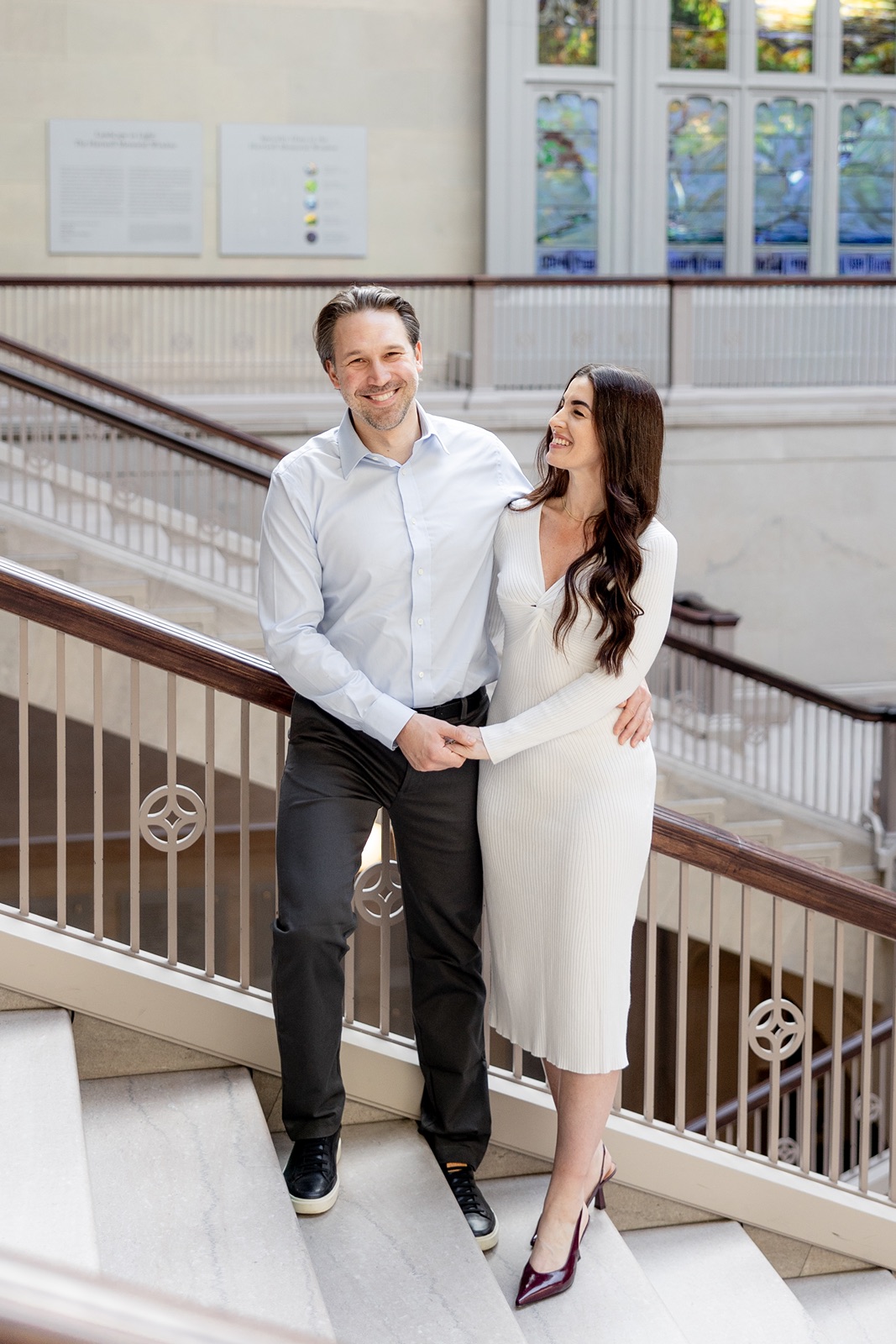 Man and woman laugh during their Chicago engagement photoshoot