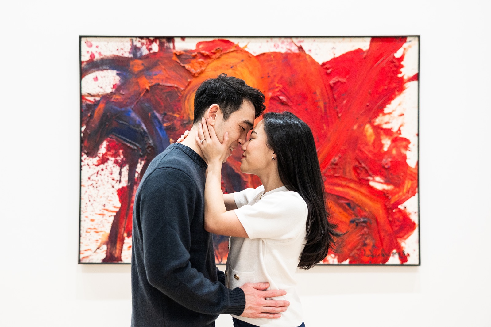 Couple embraces during their Chicago engagement photos at the Art Institute