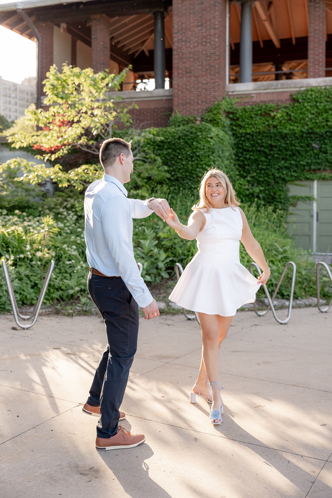 Couple dances during their Chicago engagement photos at South Pond